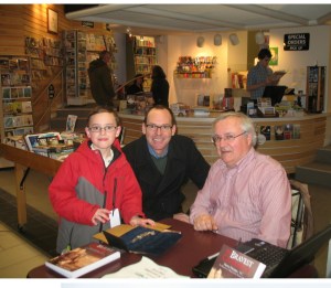 with cousins at signing